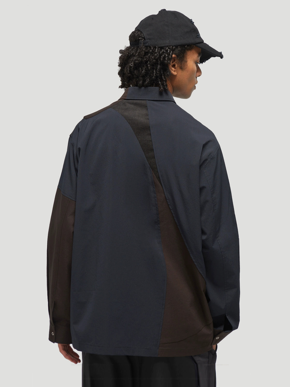 DECESOLO Multi-material paneled jacket